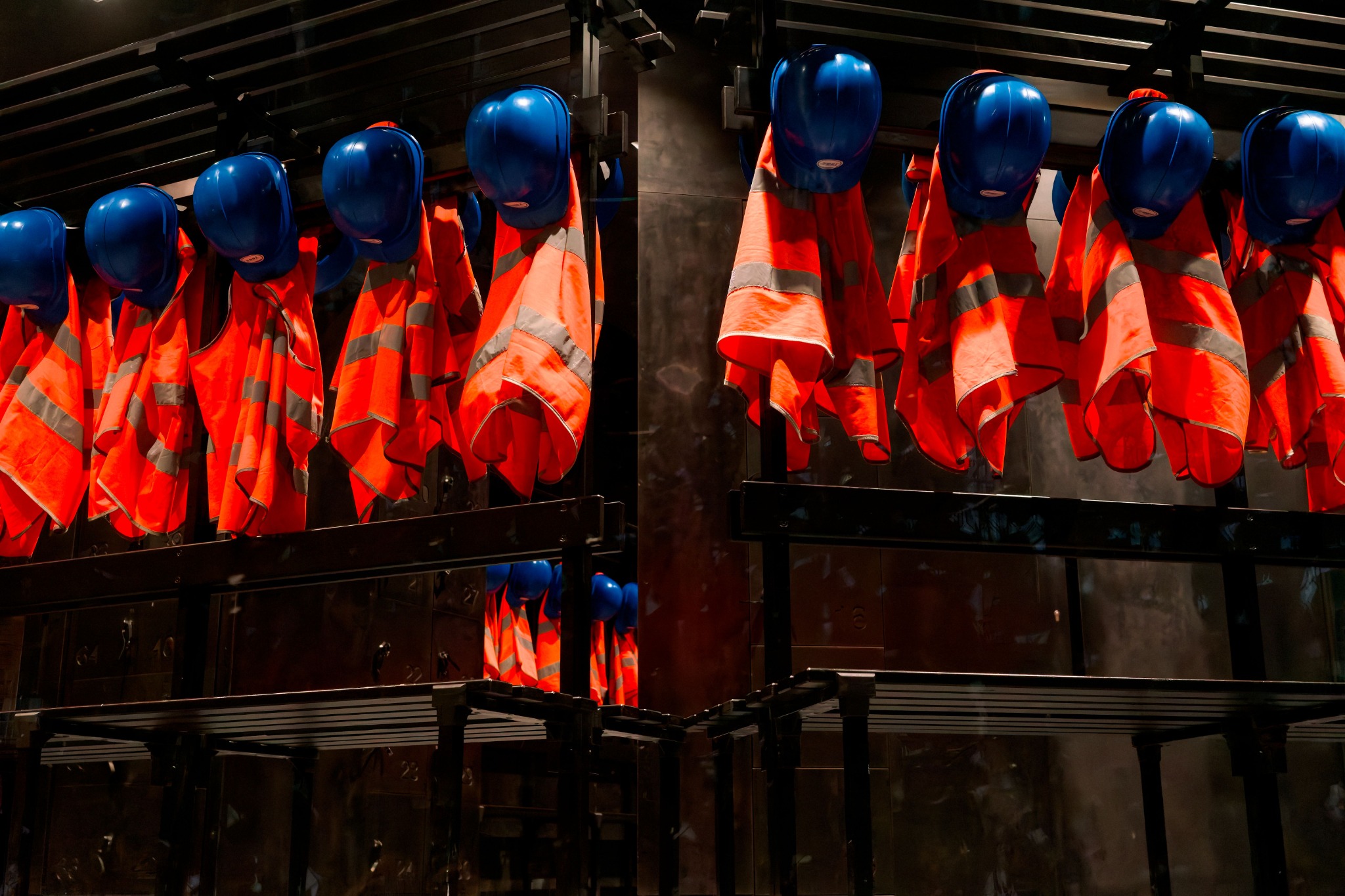 High visibility vests and safety helmets